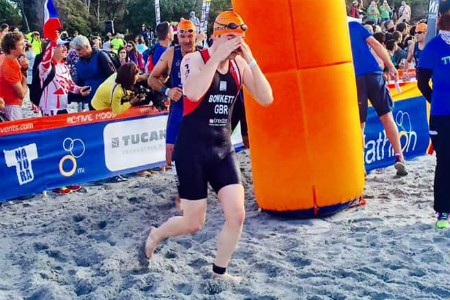 Dave in action in a triathlon just exiting the water